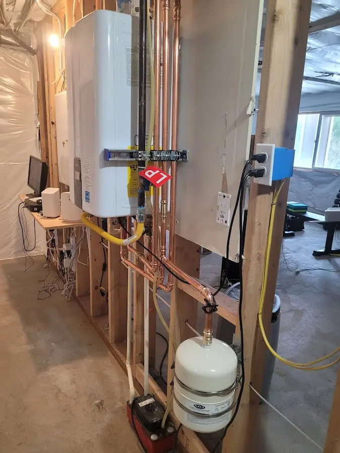 Licensed plumber repairing a kitchen sink in Deming